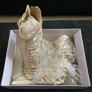 Brand new never worn gold cage open toe heels with zipper back